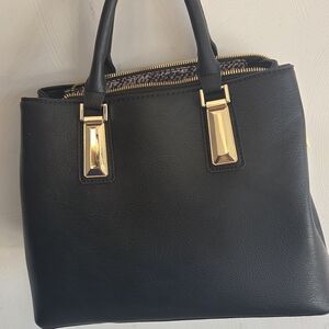 Elegant Black Handbag with Gold Accents
